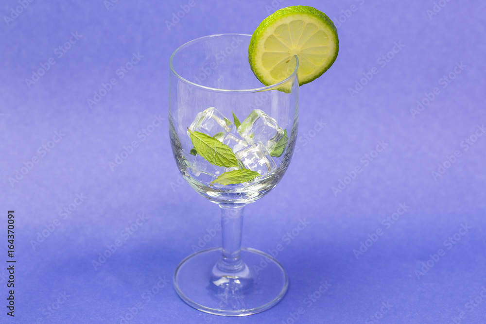 Freshness Cocktail with Mint, Ice and Lime. Lime soda mojito drink cocktail Freshness Cocktail with Mint, Ice and Lime. Lime soda mojito drink cocktail