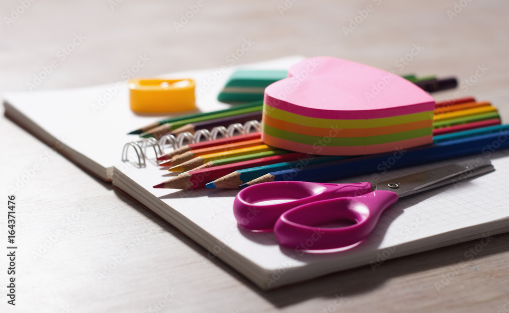 School supplies on note book School supplies on note book