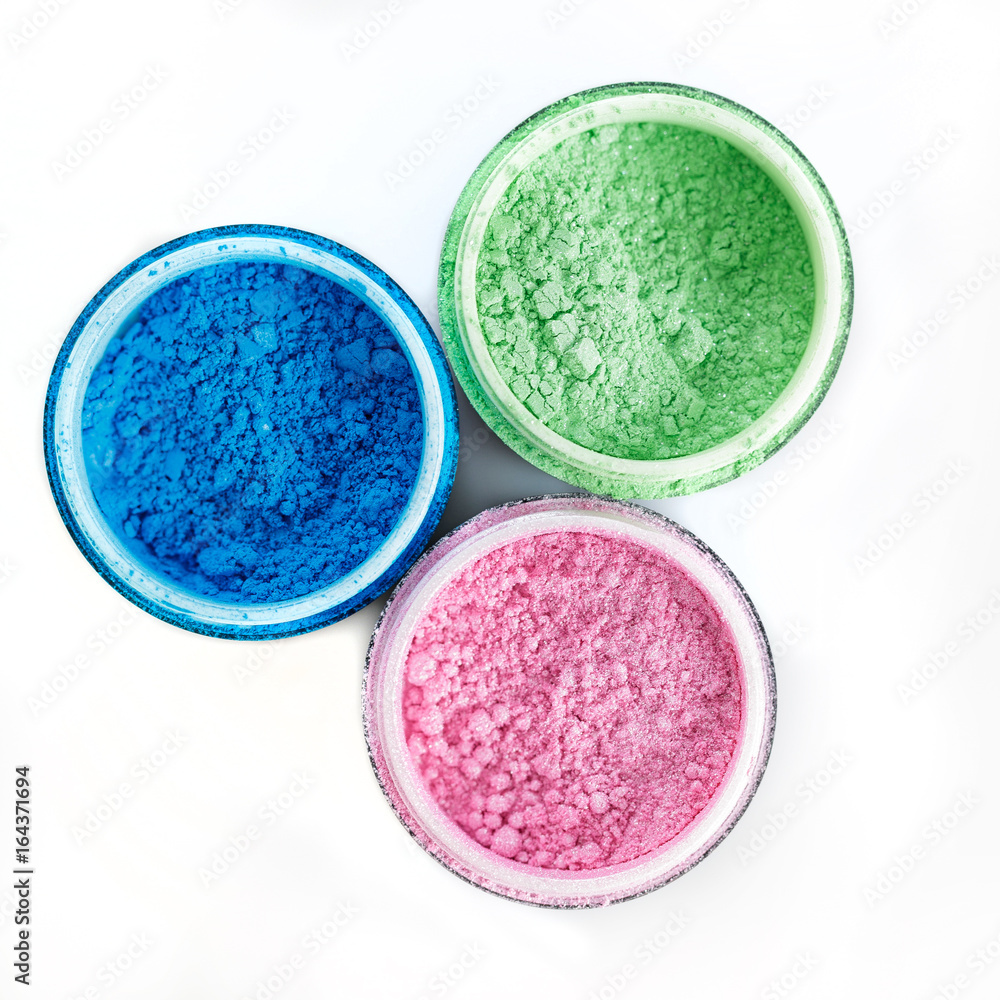 Multicolored professional powder eye-shadows on white background Multicolored professional powder eye-shadows on white background
