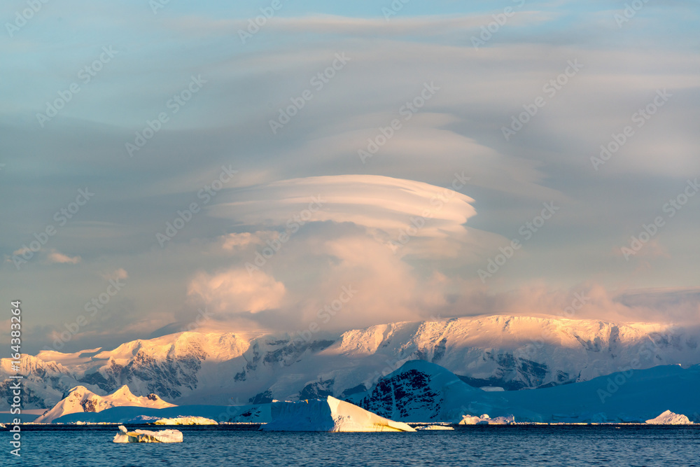 Icebergs, glaciers and mountains along the Antarctic Peninsula.