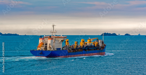 Fototapeta Hopper Dredger vessel in Strait of Singapore