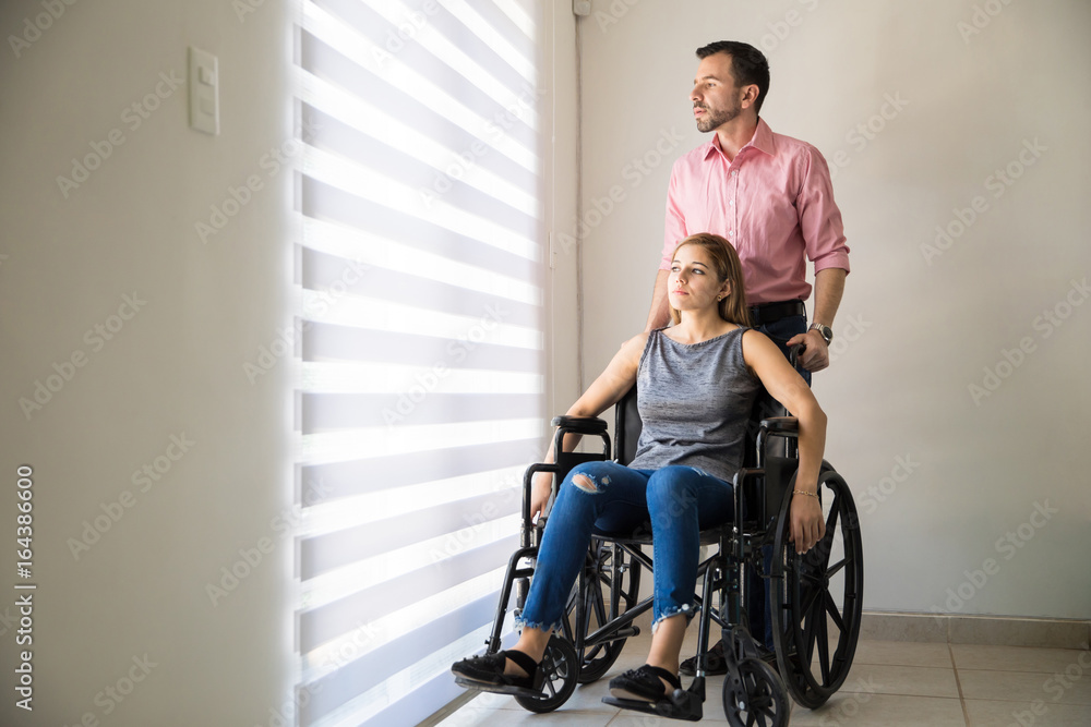 Depressed woman on a wheelchair Depressed woman on a wheelchair