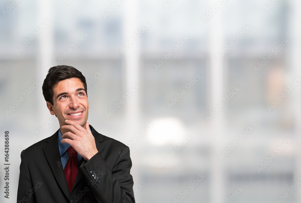 Businessman looking up to the bright copy-space Businessman looking up to the bright copy-space