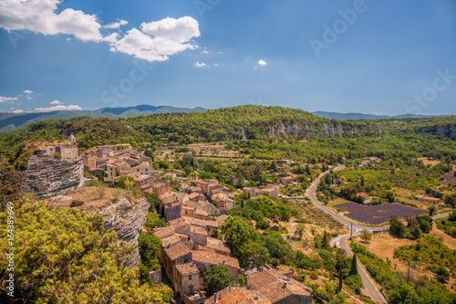 Village of Saignon with lavender field in the Luberon, Provence, France photo