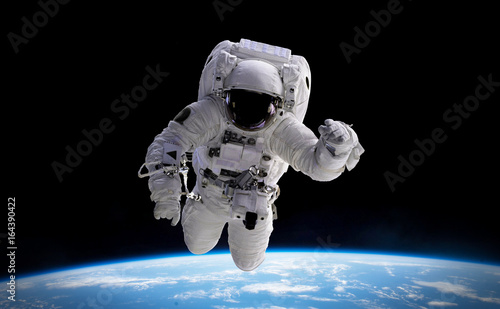 astronaut in orbit of planet Earth