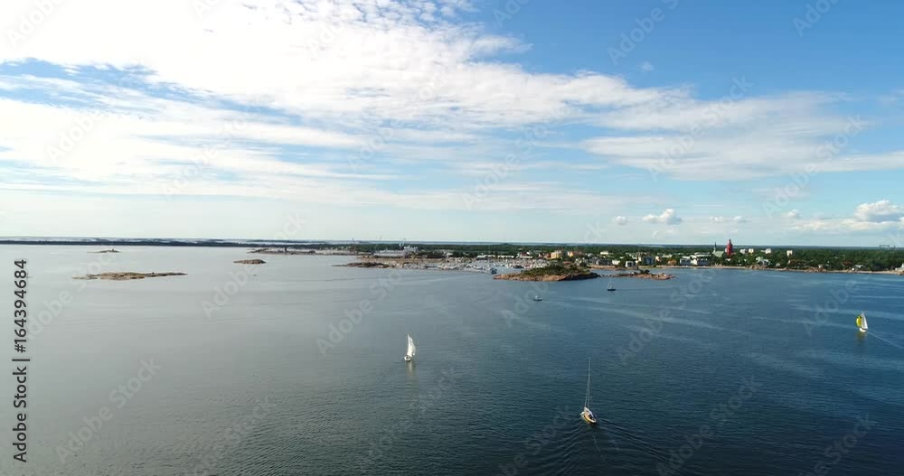 Hanko, Cinema 4k aerial view above sailboats in the baltic sea and heading towards the city, out on the finnish archipelago, turquoise sea, on regatta day Hanko, Cinema 4k aerial view above sailboats in the baltic sea and heading towards the city, out on the finnish archipelago, turquoise sea, on regatta day