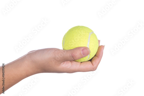 Tennis ball in hand isolated on white backgound © SUPHANSA