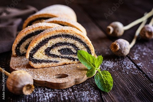 Poppy seed strudel sprinkled with powdered sugar photo