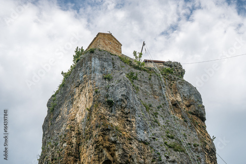 Katskhi pillar. Georgian landmarks. Man's monastery near the village of Katskhi. The orthodox church and the abbot cell on a rocky cliff. Imereti, Georgia