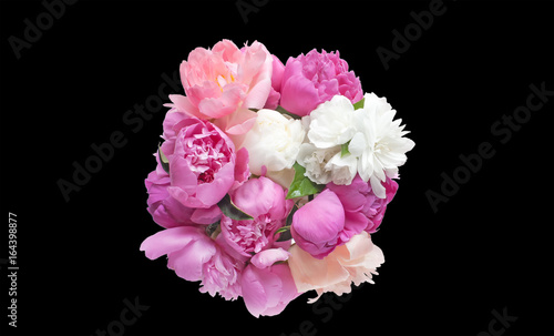 Bouquet peony flowers pink and red isolated on black background.