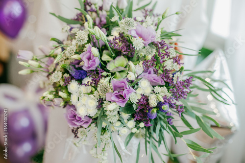 Beautiful purple wedding bouquet in bride's hands © Helga Bragina