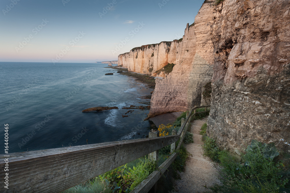 The walkway down to the pebble beach the other side of Porte d’Amont at Etretat, Normandy, France