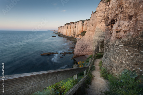 The walkway down to the pebble beach the other side of Porte d’Amont at Etretat, Normandy, France © leighton collins