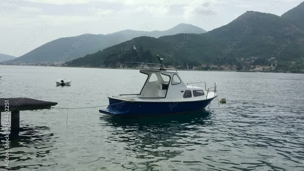 A lonely boat is anchored in the sea. Full HD video panning shot. A lonely boat is anchored in the sea. Full HD video panning shot.