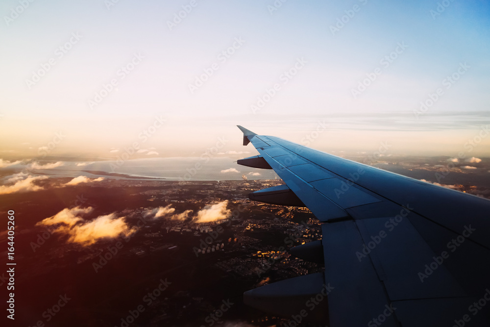 View from airplane window above evening Lisbon with few clouds b View from airplane window above evening Lisbon with few clouds b