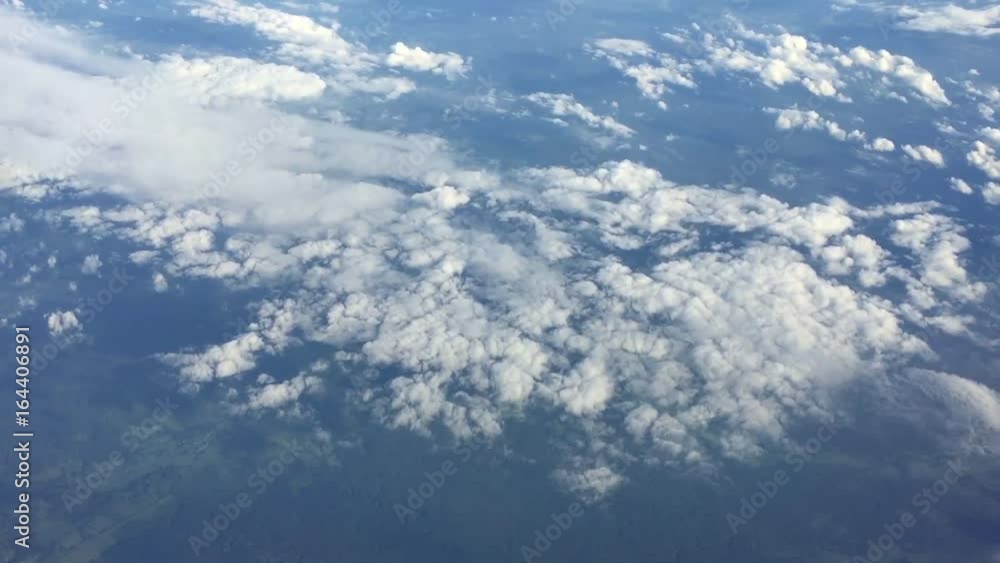 Sky clouds background. Flight high above land in clouds. On sky view. Aerial flyght in blue sky. Heavenly sky view of fly through clouds. Sky clouds background. Flight high above land in clouds. On sky view. Aerial flyght in blue sky. Heavenly sky view of fly through clouds.