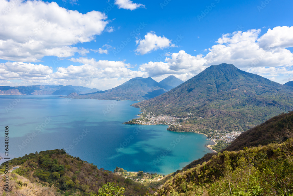 Viewpoint at lake Atitlan with the three volcanos San Pedro, Atitlan and Toliman - you can see the small villages San Pedro and San Juan at the lake in the highlands of Guatemala