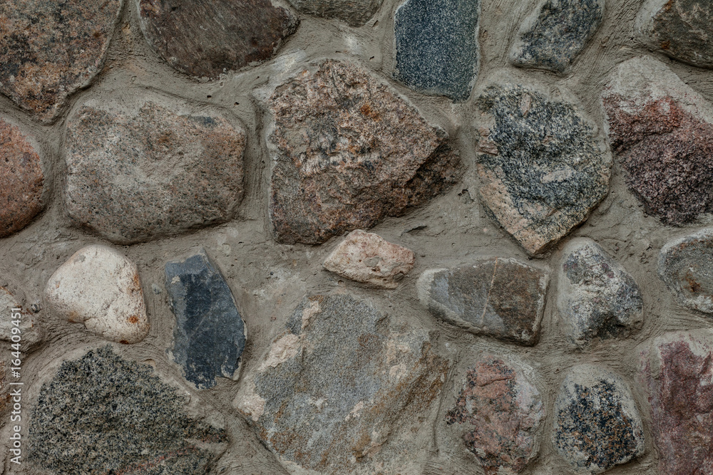 Fragment of old stone wall closeup. Fragment of old stone wall closeup.