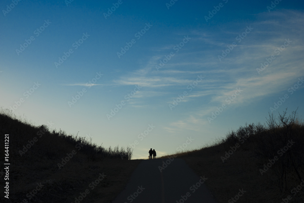 Sunset silhouette Walk - Couple in love Sunset silhouette Walk - Couple in love