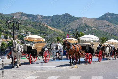 MIJAS, ANDALUCIA/SPAIN - JULY 3 : Horse and Carriage in Mijas Andalucía Spain on July 3, 2017. Unidentified people.