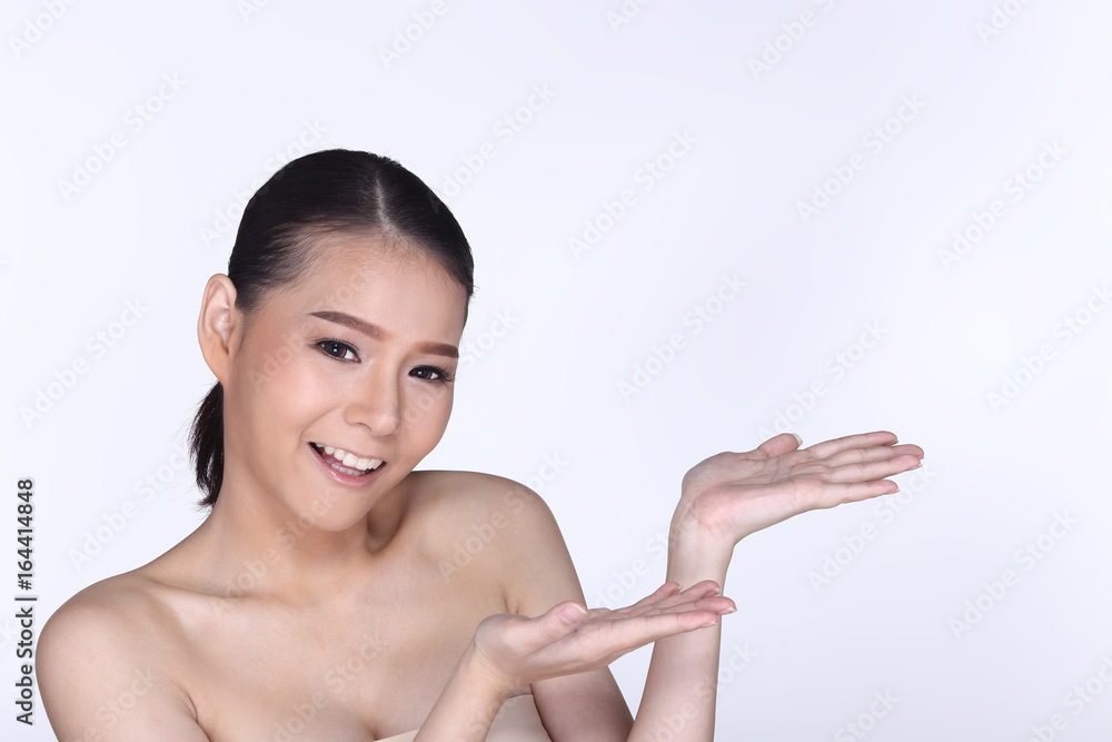 Young White Asian woman fahion make up showing empty copy space on the hand palm Young White Asian woman fahion make up showing empty copy space on the hand palm