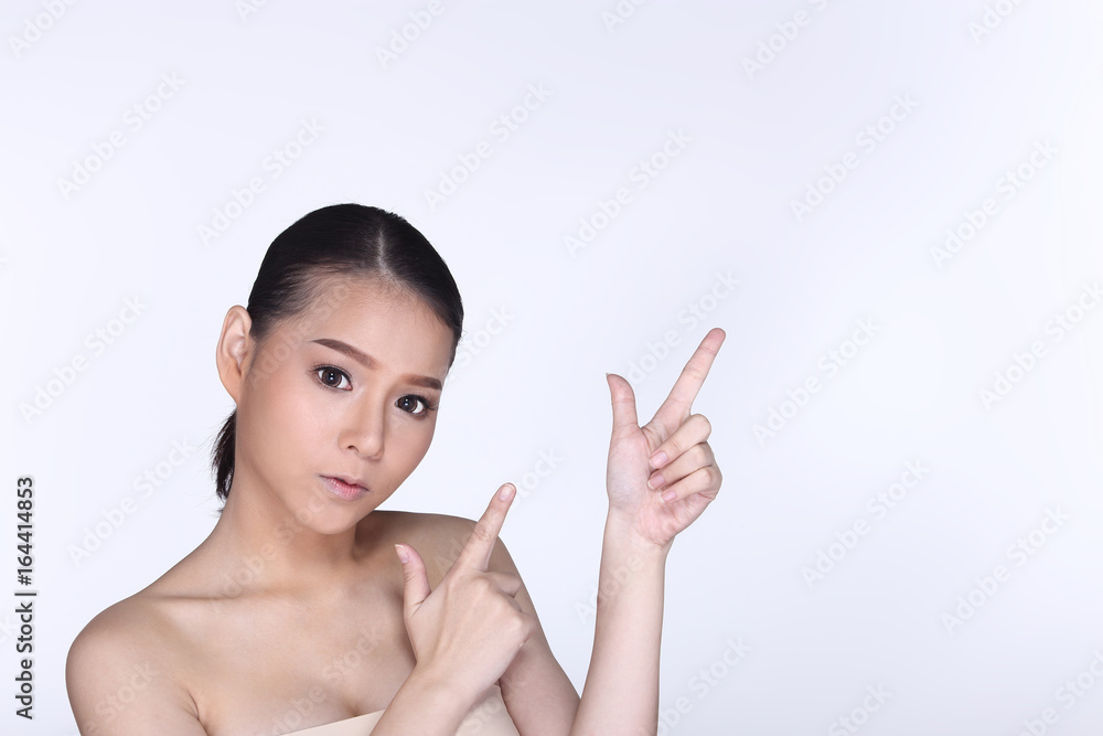 Young White Asian woman fahion make up showing empty copy space on the hand palm Young White Asian woman fahion make up showing empty copy space on the hand palm