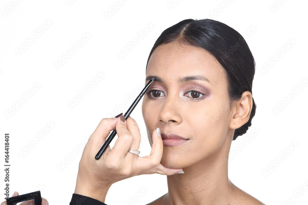 Asian Tan Skin Woman wtih Hand On applying cosmetic, Start from fresh face to finish process, studio lighting white background isolated copy space, Series pack photo Asian Tan Skin Woman wtih Hand On applying cosmetic, Start from fresh face to finish process, studio lighting white background isolated copy space, Series pack photo