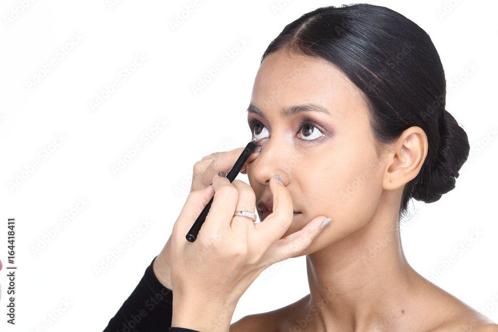 Asian Tan Skin Woman wtih Hand On applying cosmetic, Start from fresh face to finish process, studio lighting white background isolated copy space, Series pack photo Asian Tan Skin Woman wtih Hand On applying cosmetic, Start from fresh face to finish process, studio lighting white background isolated copy space, Series pack photo