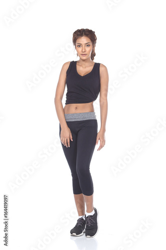 Tan Skin Asian Fitness Girl in Sexy Cute Sport Bra black spandex pants Exercise warm up in white studio room, practice pose stand full body