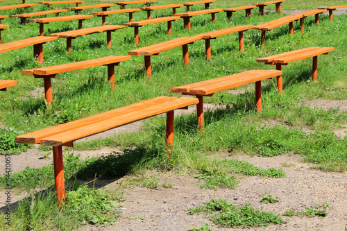 A lot of benches in the park photo