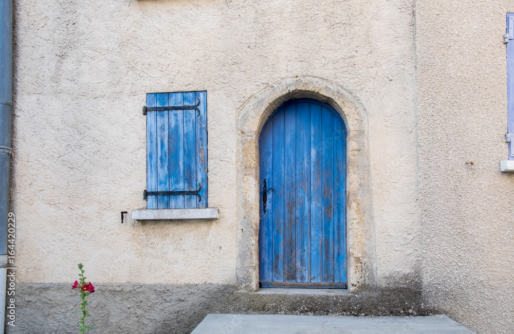 Fototapeta premium Provence style blue wooden doors and window shutters