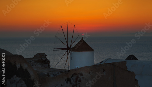 Historic windmills in the town of Oia , Santorini, Greece 