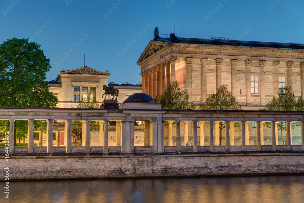 The Old National Gallery with the river Spree in Berlin at night