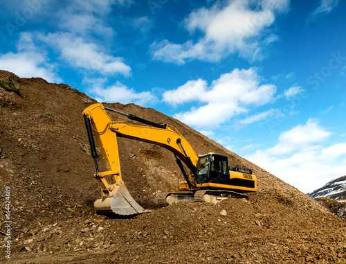 Road construction work with excavator