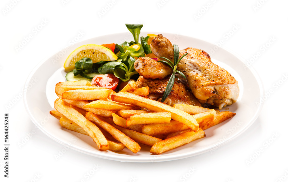 Roast chicken leg with french fries on white background Roast chicken leg with french fries on white background