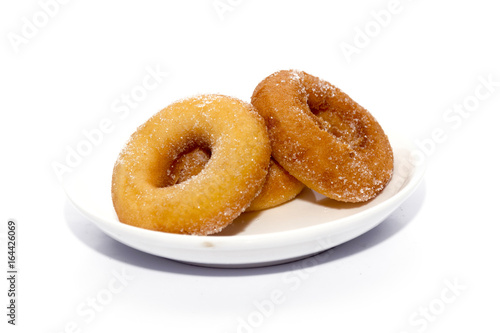 donut on white plate isolated on white
