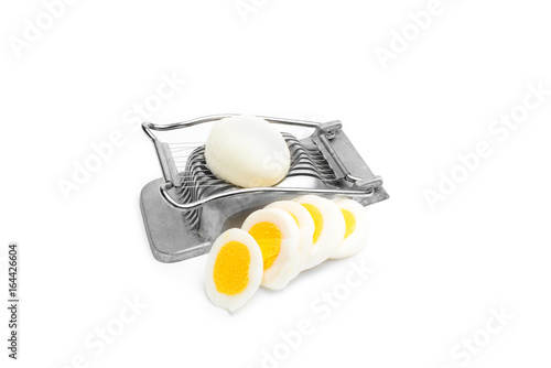 Fényképezés Retro egg slicer and eggs on white background