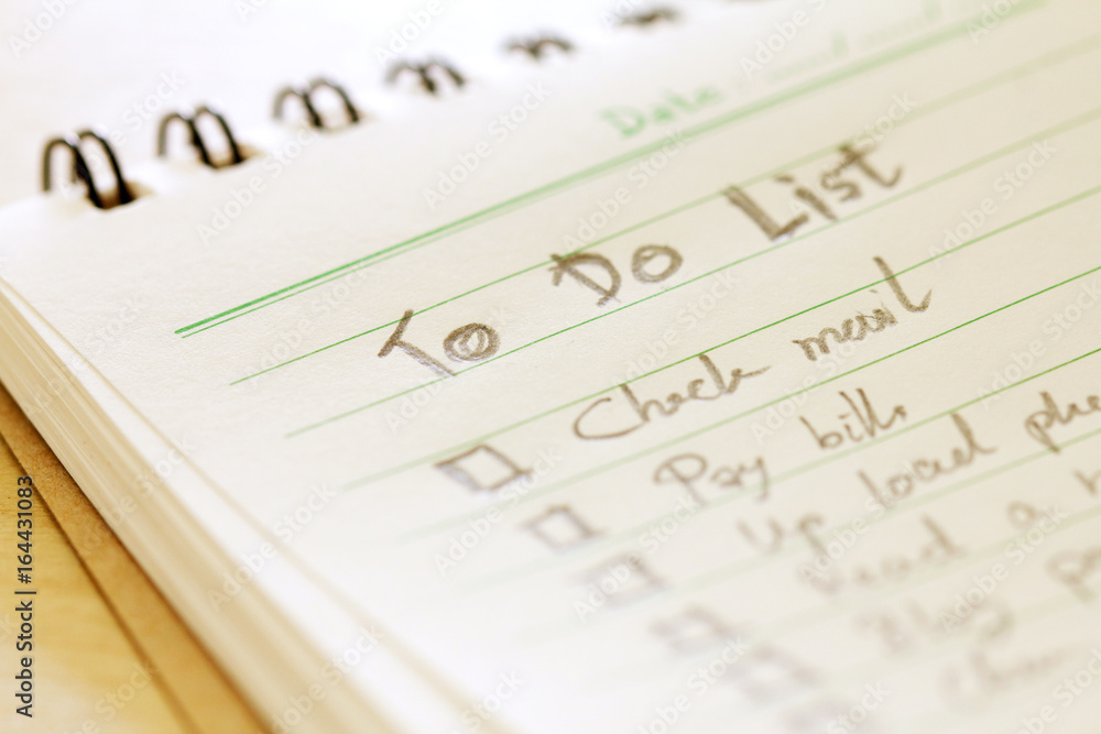 close up Handwritten to do list plan in small note book close up Handwritten to do list plan in small note book