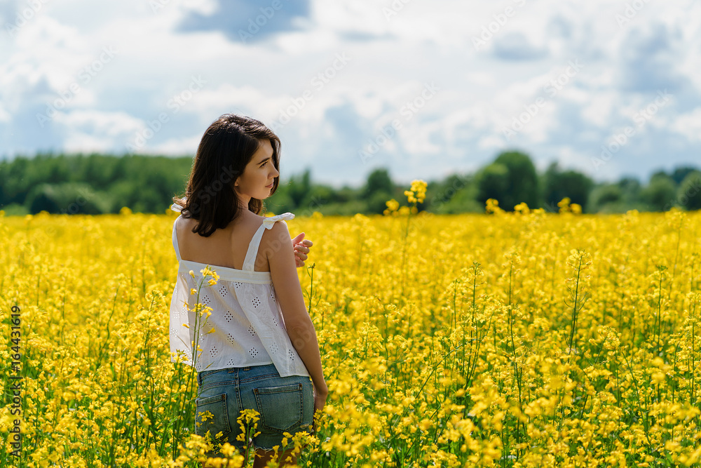 Dreamy Young Woman in bright yellow field Dreamy Young Woman in bright yellow field