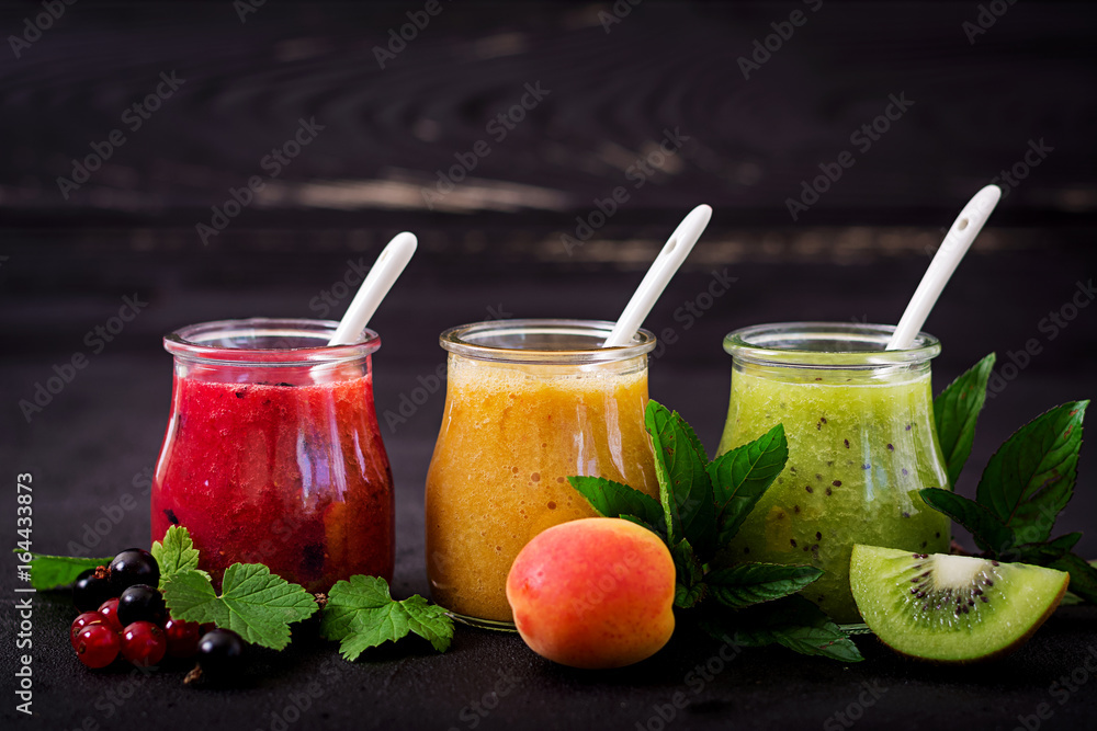 Fresh healthy smoothies from different berries on a dark background. Diet menu. Proper nutrition. Fresh healthy smoothies from different berries on a dark background. Diet menu. Proper nutrition.
