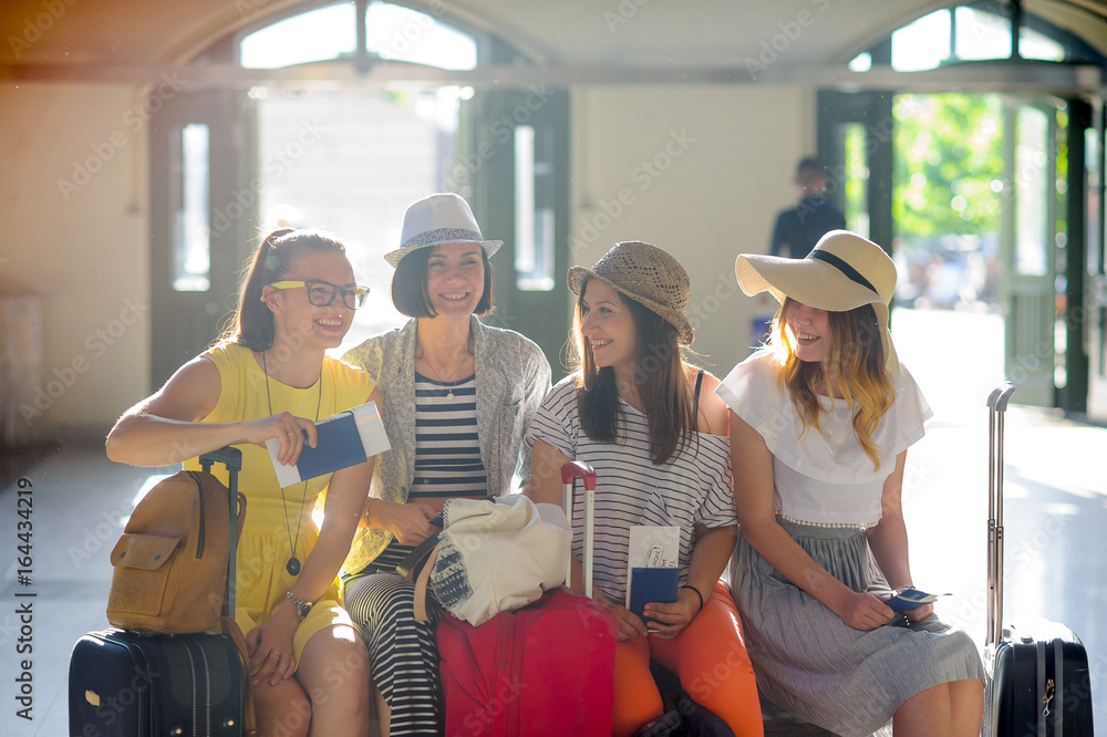 Cheerful girls at the station. Cheerful girls at the station.