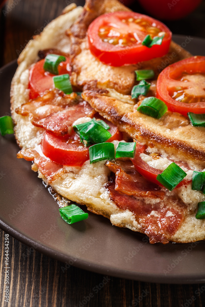 Omelette with bacon and tomatoes Omelette with bacon and tomatoes