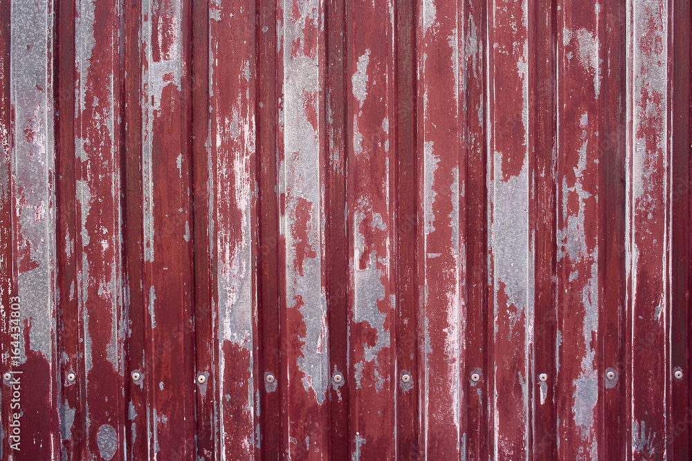 textured background of a fence with peeling paint
