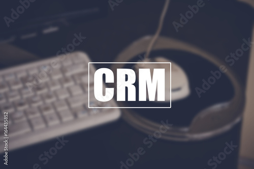 crm word with blurring business background, customer relationship management concept