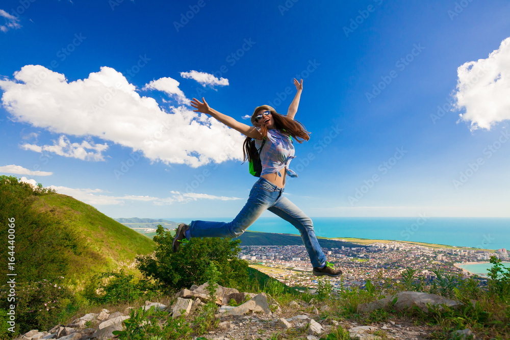 Fototapeta premium Mountain sea summer. Jeans. Jump