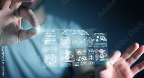 Businessman using digital screens with holograms datas 3D rendering