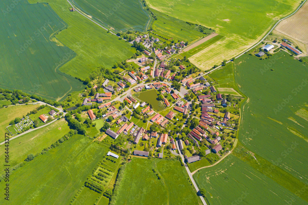 Aerial view of beautiful village in summer countryside. Old village