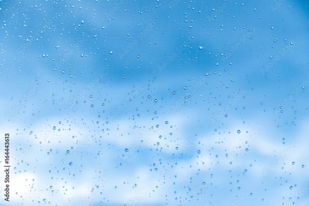 Wet window and blue sky, background. Wet window and blue sky, background.
