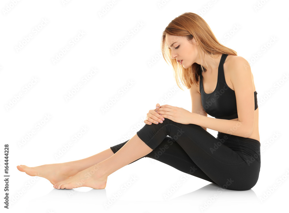 Young woman suffering from pain on white background. Concept of orthopedist