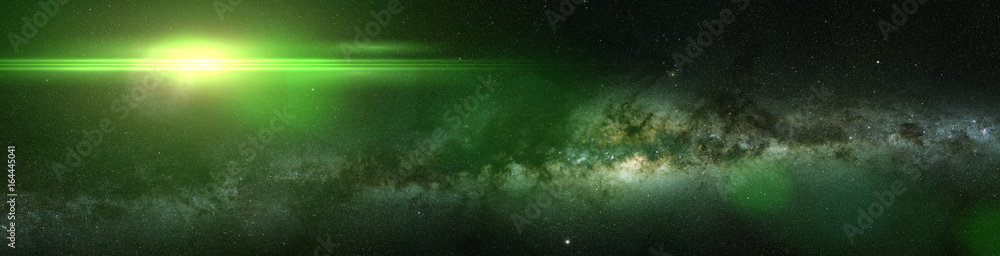Naklejka premium bright green star and the Milky Way galaxy